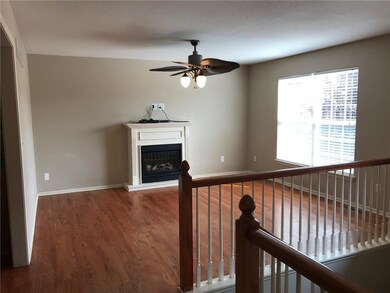 Living room with fireplace, custom ceiling fan and
