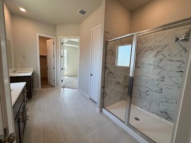 Full bathroom featuring a marble finish shower an