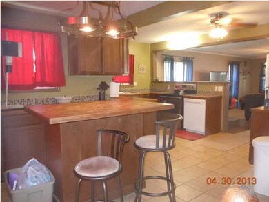 ONE VIEW OF KITCHEN AND ONE EATING BAR WHICH IS ON