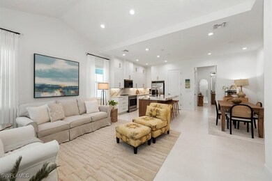Living room with recessed lighting and vaulted cei