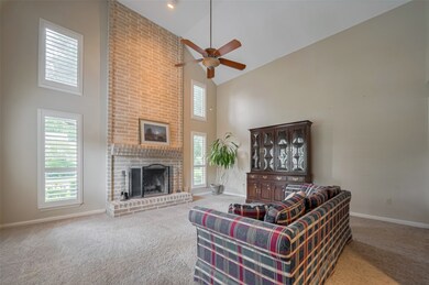 High ceilings and spacious living/family room! Per