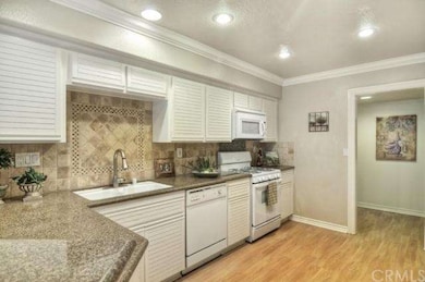 Large open kitchen with recessed lights and crown 