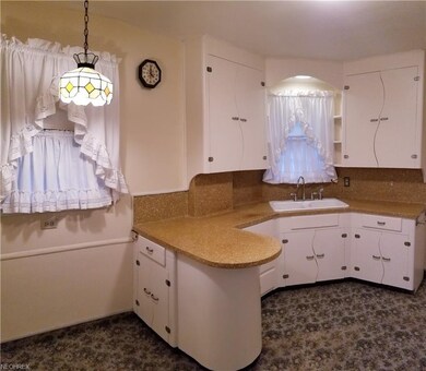 Unique kitchen cabinetry adds to the character of 