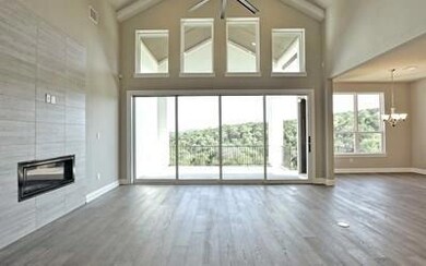 Unfurnished living room with a chandelier, wood f