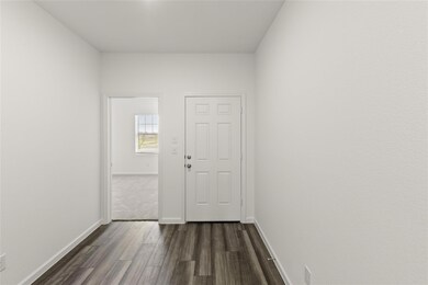 Corridor with dark hardwood / wood-style floors