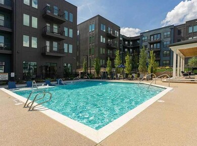 View of swimming pool with pool water feature