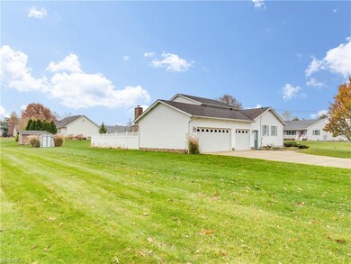 3 car garage and storage barn with riding lawn mow