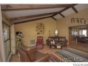 Living Area w/ Beamed Ceiling