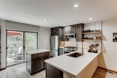Remodeled kitchen with updated cabinets, counterto