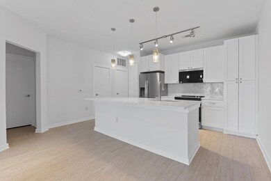 Kitchen with stainless steel fridge with ice disp