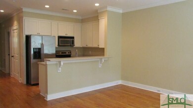 Kitchen area includes, refrigerator, microwave, ov