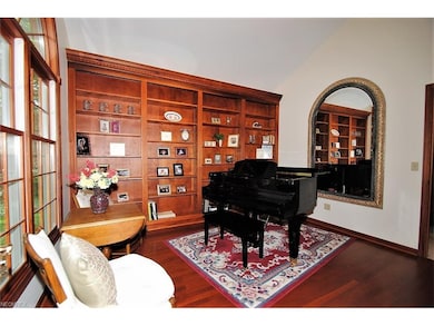 Dramatic library/office with wall of built in shel