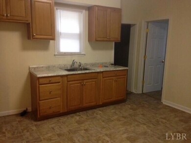 Kitchen with new cabinets,countertops and vinyl flooring.