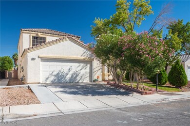 Mediterranean / spanish home with driveway, stucco siding, an attached garage, and a tile roof