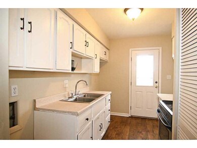 Kitchen. All the cabinets have been  freshly painted with new hinges and pulls.  New flooring and fresh paint complete the room