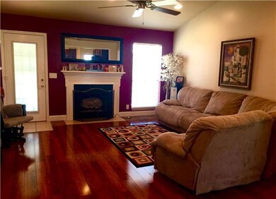 A very open and spacious den with new laminate hardwoods and paint.  Doors take you out to a super nice covered porch.  
