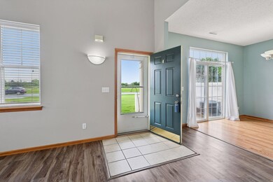 The screen door lets the breeze in and there is practical ceramic tile at the entrance.