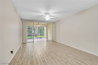 Unfurnished room featuring ceiling fan, wood finis