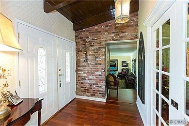 Interior view at entry. double sliding doors lead into formal dining room.