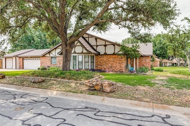 View of front of house featuring a garage and a fr