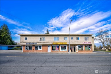 Dynamic mixed-use asset in Everett’s revitalizing urban core. Interurban Crossing spans a 26,572 SF corner lot with alley access, 20+ parking spaces, and a 7,629 SF structure leased to stable local tenants—3 storefronts, 3 apartments, and 3 flex spaces. Current gross rent over $64K; pro forma $144K+ with light upgrades. Just 26.3% lot coverage—NB zoning + Opportunity Zone offer phased development potential. Steps from the Interurban Trail, future light rail, and new stadium district. A walkable, well-connected location with built-in income and big upside....