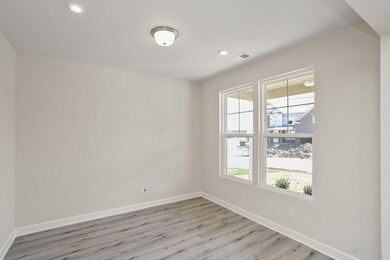 Study/Office accented by glass framed French doors, right off entry. Similar home, same plan. Colors and selections may vary.