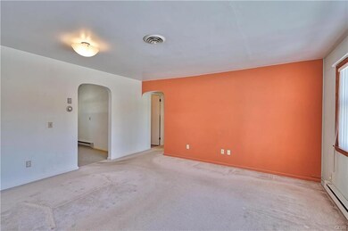 View of archway to kitchen/dining area & hallway t