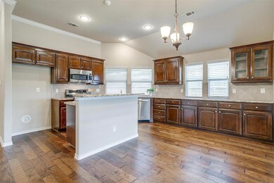 Kitchen with appliances with stainless steel finis