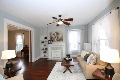 Gorgeous wood floors and original fireplace tile i