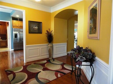 Open foyer. Custom paint throughout  The seller loves these paint colors, but they may not work for you... let's talk!