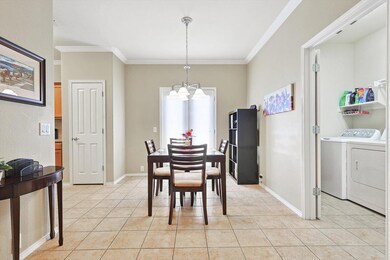 Breakfast Nook and Entry to Utility Room With a Si
