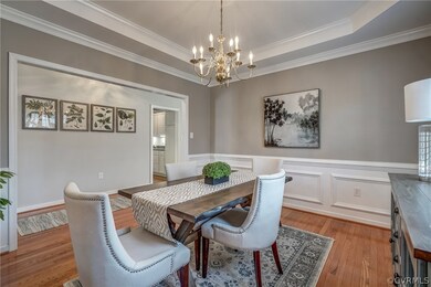The Formal Dining Room features more lovely hardwo