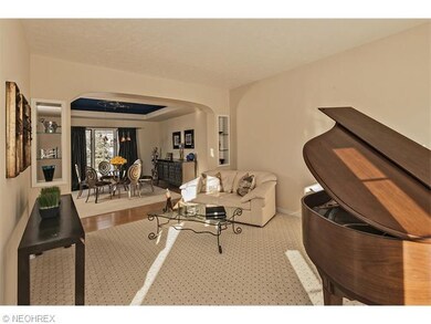 Cozy living room opens up to the formal dining roo