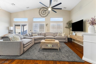 Living area featuring wood finished floors, visibl