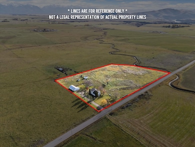 View of rural area with property parcel outlined and mountains