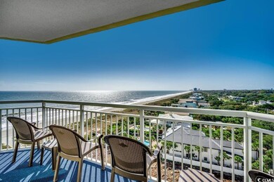 Balcony with a water view and a view of the beach
