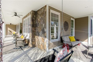 Wrap-around Front Porch also includes a Swing!