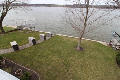 Lakeside lawn.  Dock is stacked along the sidewalk