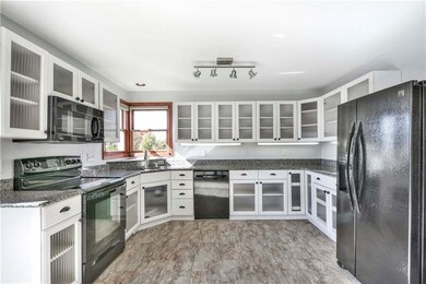 Open & bright kitchen with granite countertops!