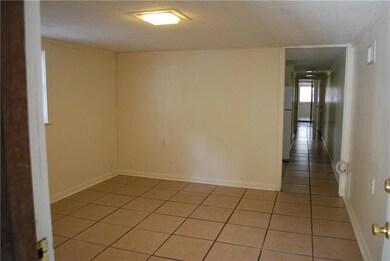 Living area has tile floors, central a/h.