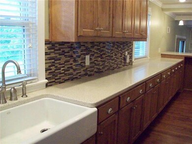 Loads of cabinets and tons of solid surface counte