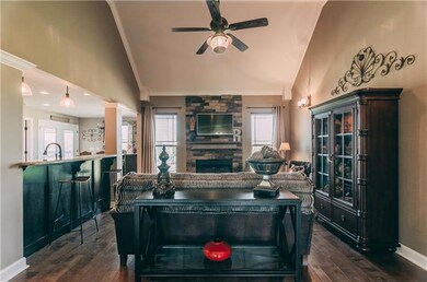 Gorgeous hardwood and stone fireplace! Wow what an entry! 