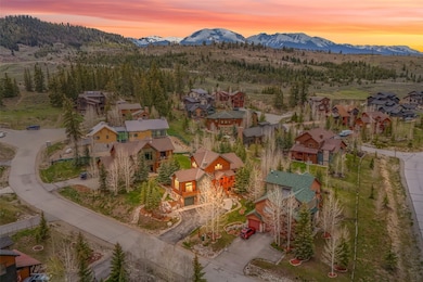 Aerial view at dusk of a mountain view and a resid
