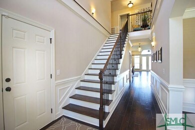 This gorgeous stairway greets you as you enter and