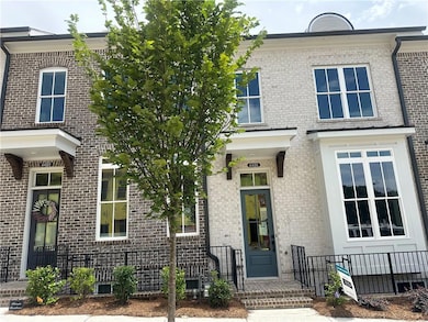 Awning over front door and stoop to enter.