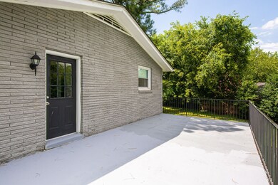 Balcony off Master Bedroom Upstairs - could easily add stairs that lead to backyard.