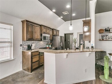Kitchen:  The kitchen opens up to the dining and l