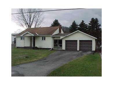 Exterior Front. Paved driveway with oversized two 