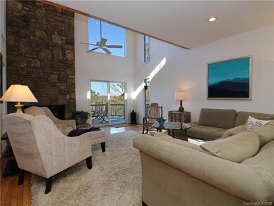 Multiple, over sized windows fill the living room 