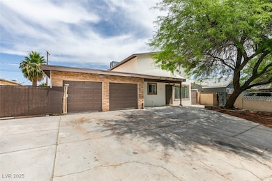 View of front of house with a garage, stucco sidin